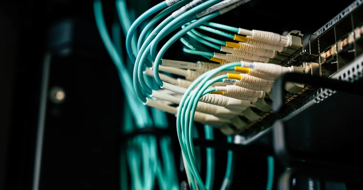 Network cables in a server room used as a visual cue for public IPv4 cost review